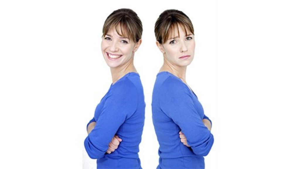back to back mirror image of woman, one smiling, one looking weary (her energy has dipped)