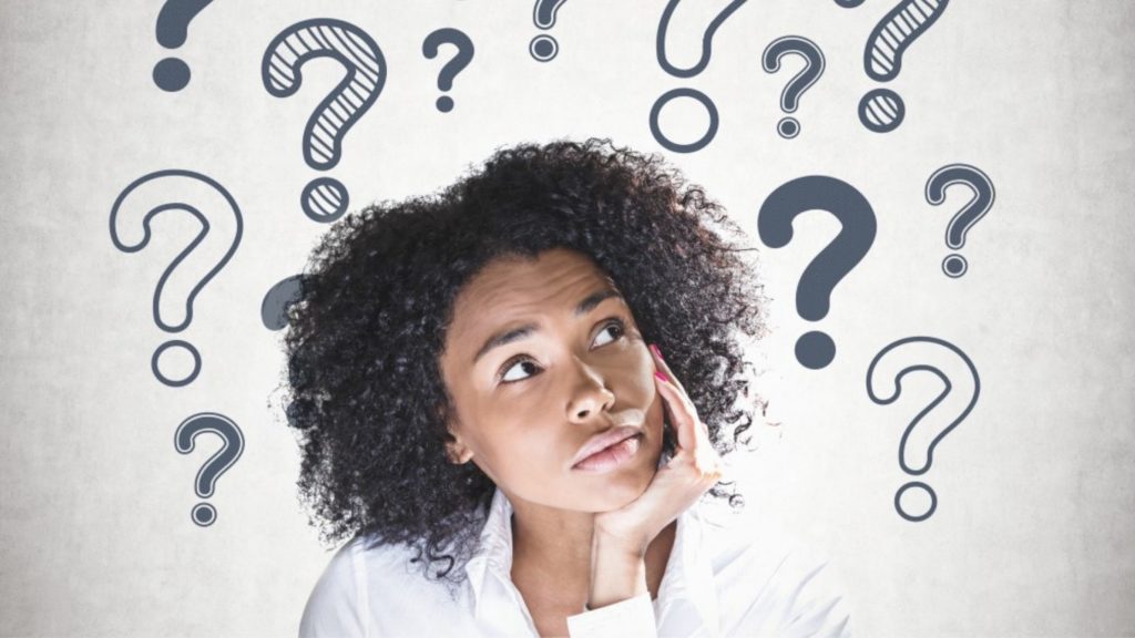 woman pondering, decision making, with question mark graphics in the background
